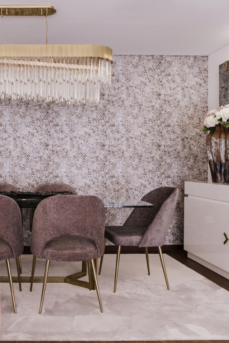 Elegant dining room in pink tones by IN_CANTOS with Kingdom Suspension by Castro Lighting.