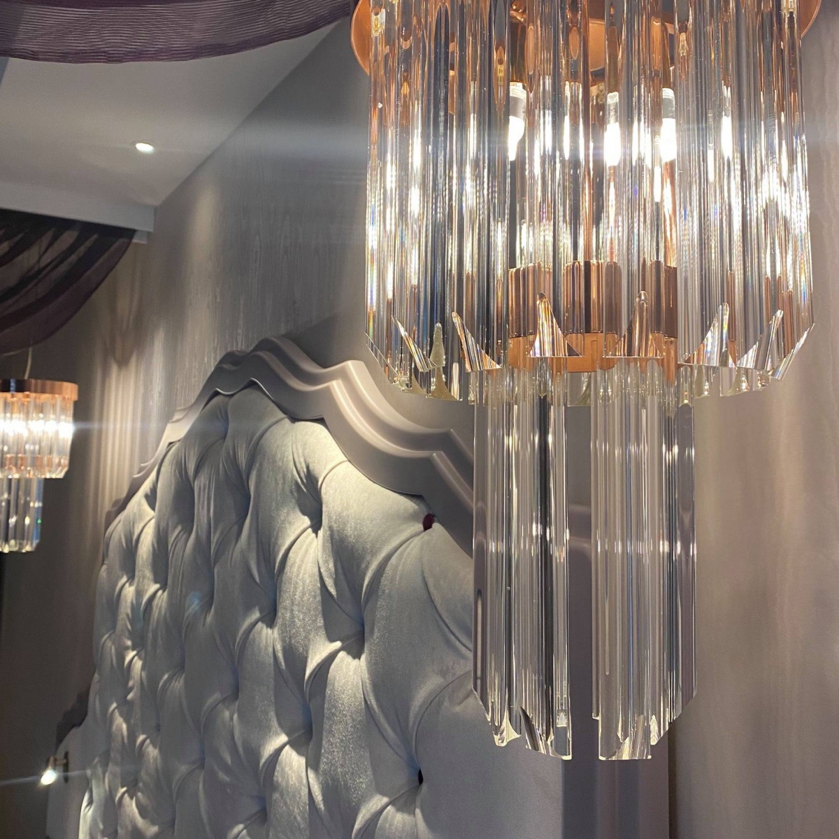 Paris hotel suite with Royal Pendant by Castro Lighting, blending pink elegance with regal charm.