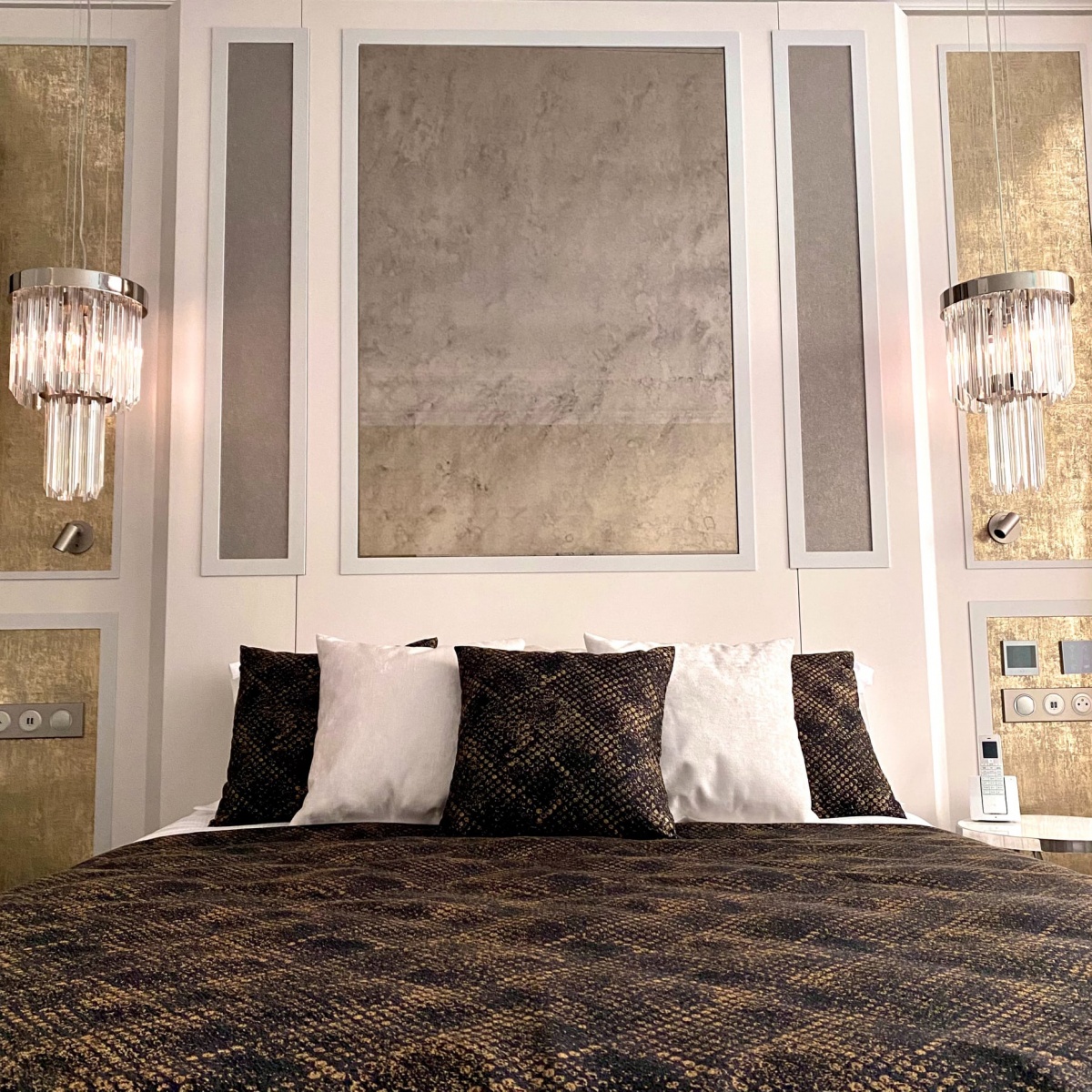 Paris hotel suite with Royal Pendant by Castro Lighting, blending pink elegance with regal charm.